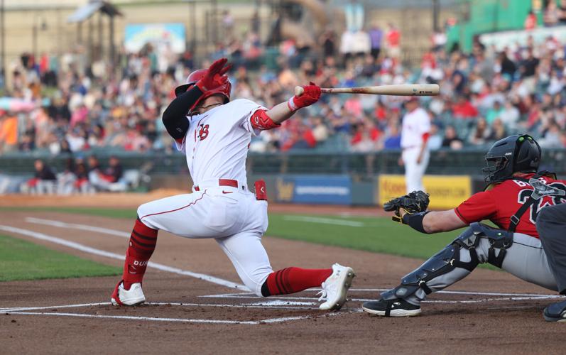 Bats player swings and misses.JPG