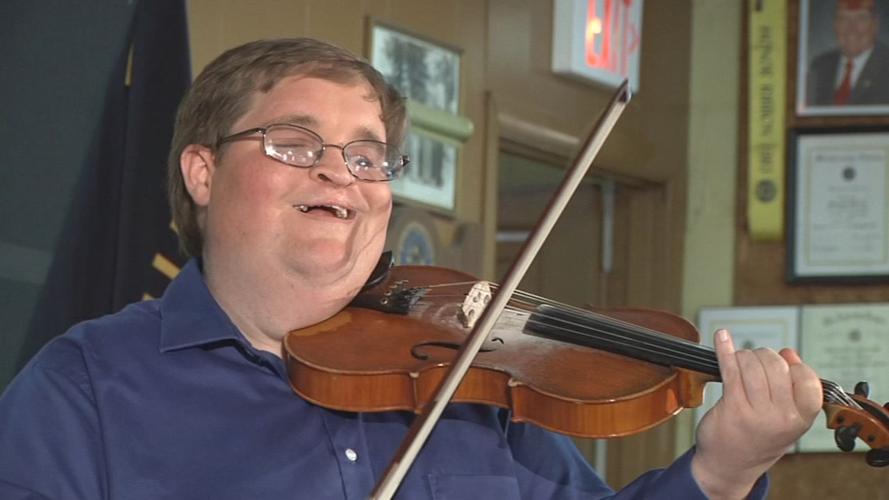 MICHAEL CLEVELAND GRAMMY WIN 5pPKG.transfer_frame_8078 playing.jpg