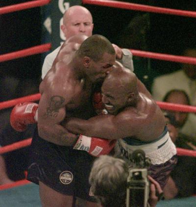 Mike Tyson biting into the ear of Evander Holyfield