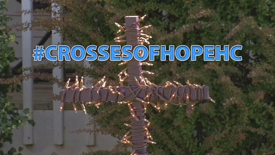 Homemade crosses appear in front yards to encourage 'faith over
