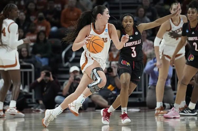 Texas guard Shaylee Gonzales drives around Louisville.jpg