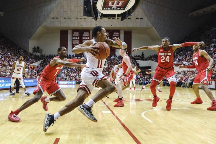Indiana guard Devonte Green (11) drives in front of Ohio State guard Luther Muhammad