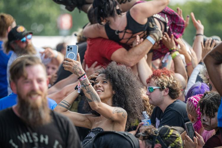 A fan finishes her video after crowd surfing at the Louder Than Life Festival on September, 21, 2025 in Louisville, Kentucky (25 of 175).jpg