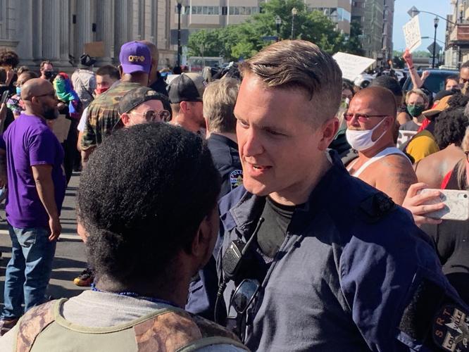 LMPD officer hugs protester-6-1-20 (3).JPG
