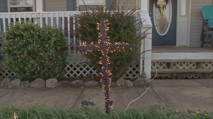 Homemade crosses appear in front yards to encourage 'faith over