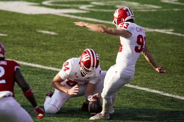 Indiana's Haydon Whitehead (94) holds the ball as Charles Campbell (93) kicks a field goal