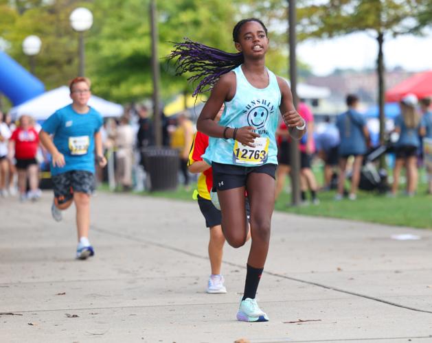 Girl runs at Race to Cure Sarcoma.JPG