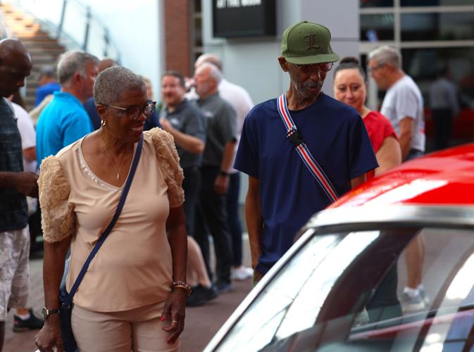 Two people view Street Rods.JPG