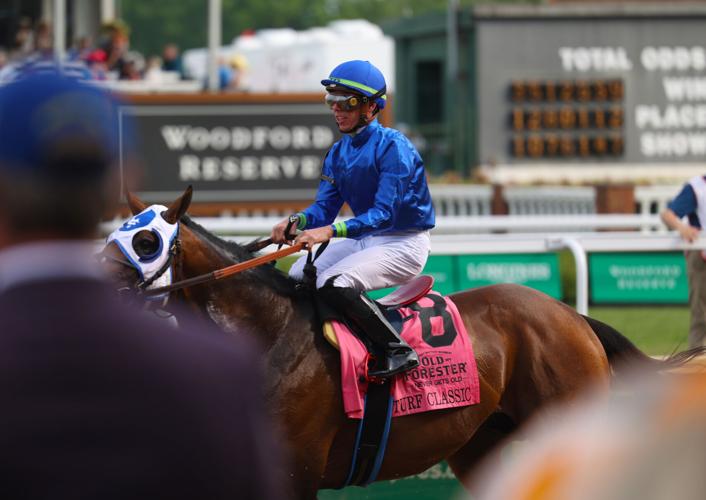 Jockey rides a horse at Churchill Downs.JPG