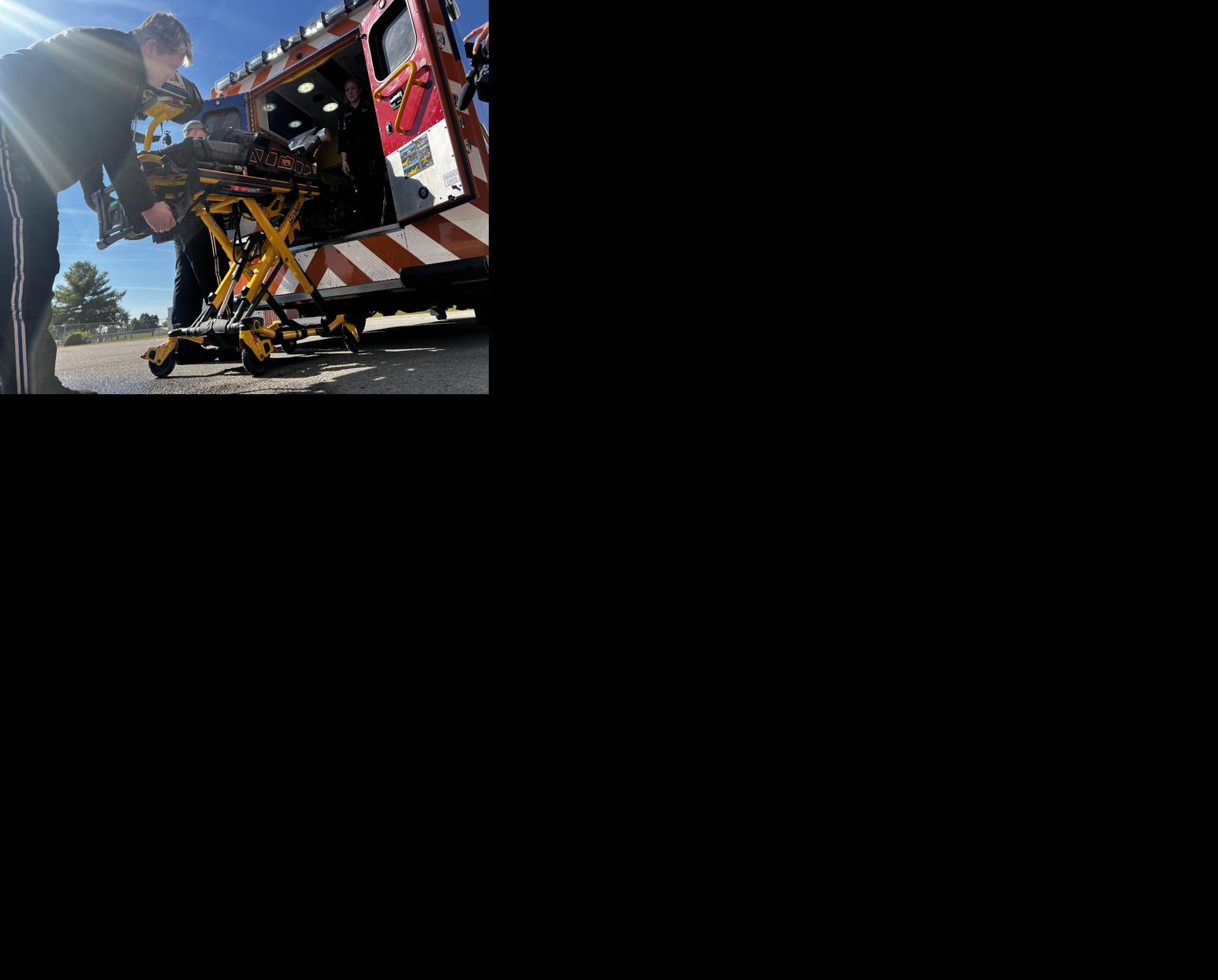 Team loads up ambulance to move patient at Norton Children's Hospital in downtown Louisville