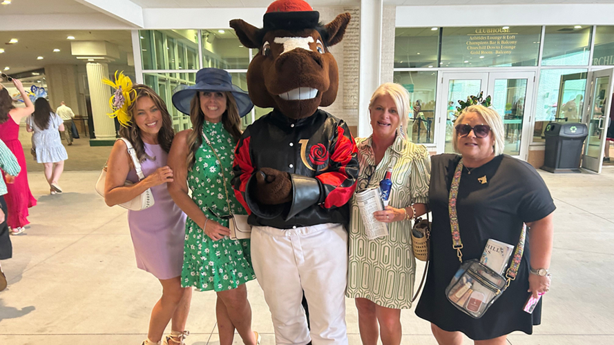 Racing fans pose with 'Churchill Charlie' on 502sDay