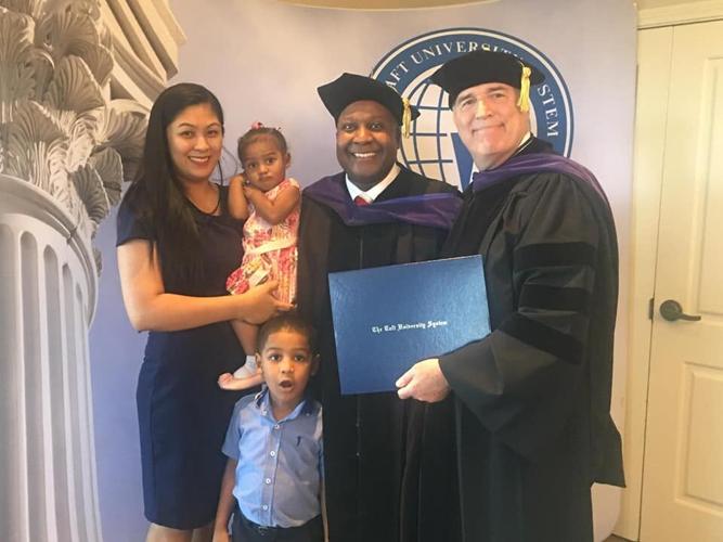 Wellington smiles during law school graduation