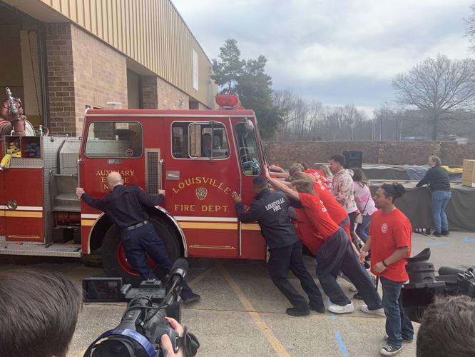 Fairdale High School students near new fire truck