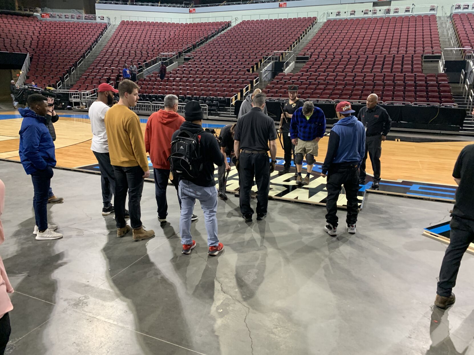NCAA FLOOR  BEING INSTALLED AT YUM CENTER 3-21-2023 (12).JPG