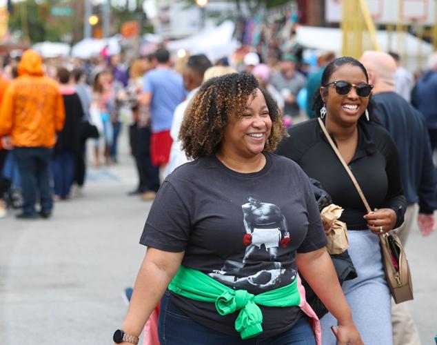 Women smile while walking at Harvest Homecoming.JPG