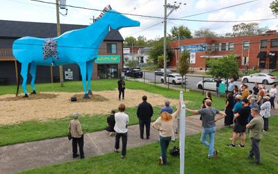 People view the Messenger sculpture in Portland.JPG