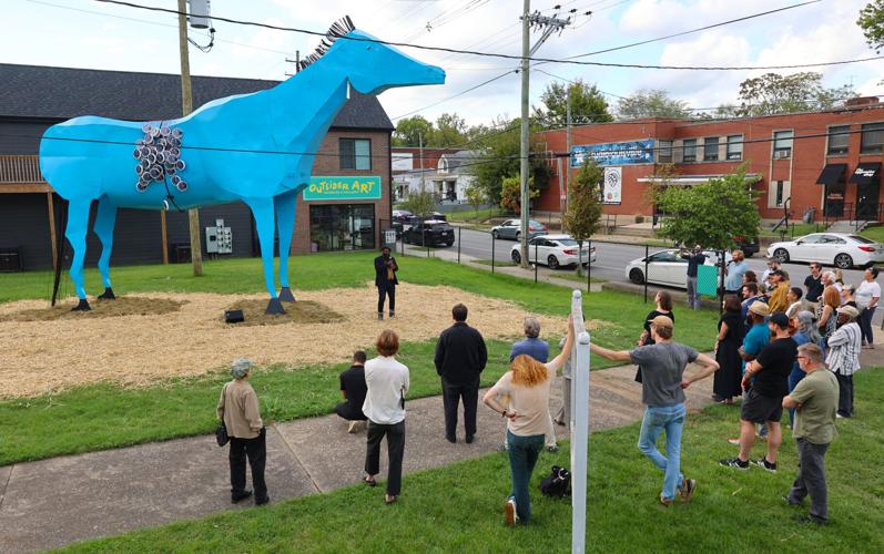 People view the Messenger sculpture in Portland.JPG