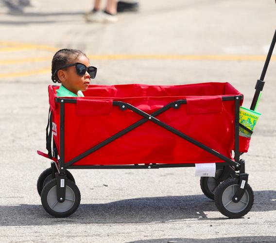 Child wears sunglasses at the state fair.JPG