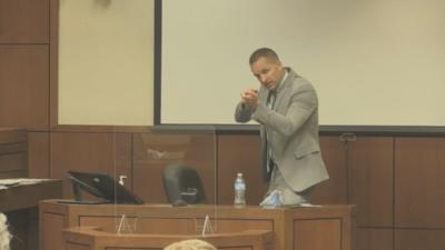 Hankison demonstrates during testimony on witness stand
