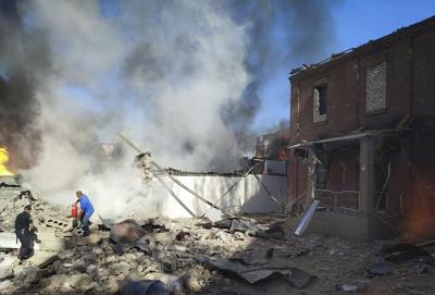 AP - People fight fire in Ukraine after drone attack