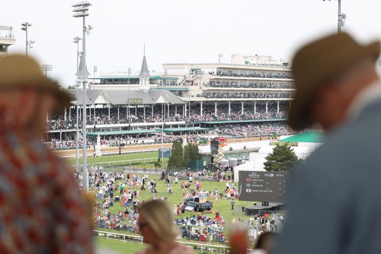 People watch from First Turn Club.JPG