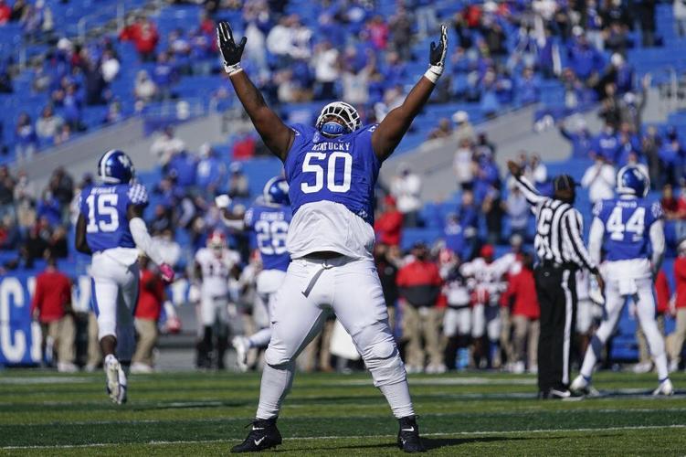 Kentucky defensive tackle Marquan McCall celebrates an interception