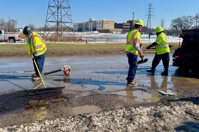 CREWS WORKING ON POTHOLES AFTER WINTER STORM 5.jpg