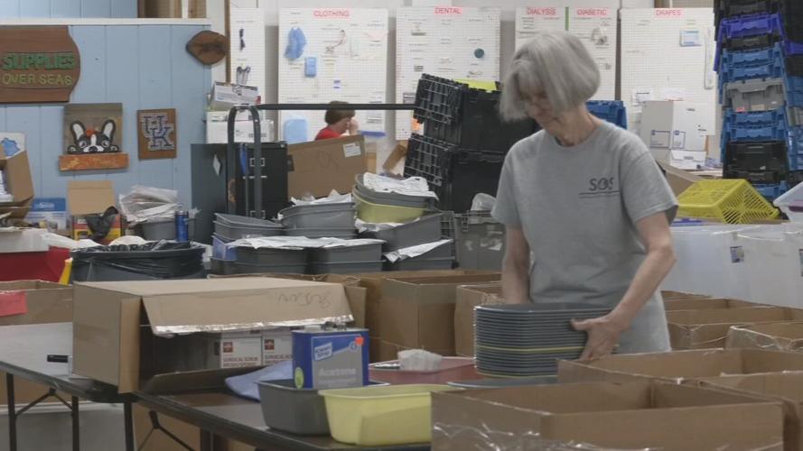 Volunteers for Louisville-based SOS pack medical supplies for JCPS students