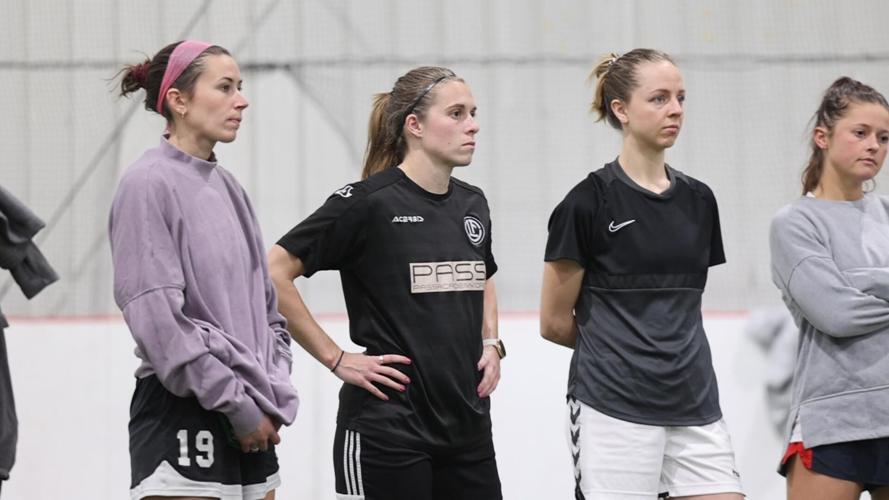 Louisville Triumph listens to coach during training session