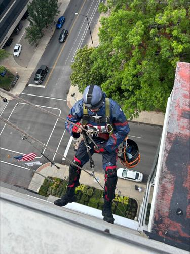 Window washers rappel from Norton Children's Hospital dressed as superheroes