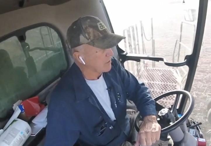 Indiana farmer Lloyd Hayden on his combine