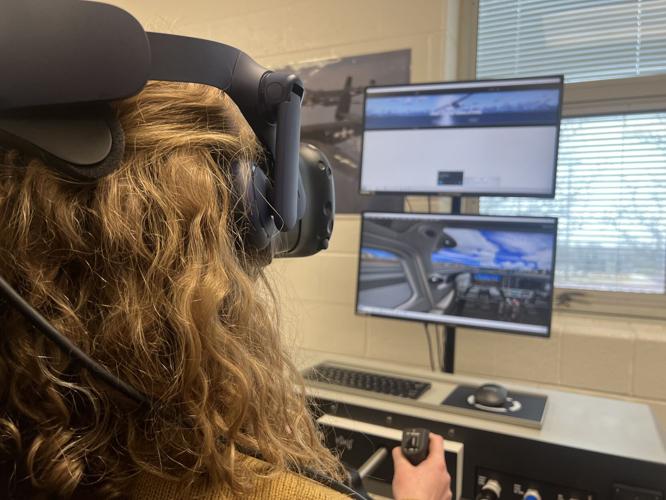Breckinridge County H.S. student practices on flight simulator