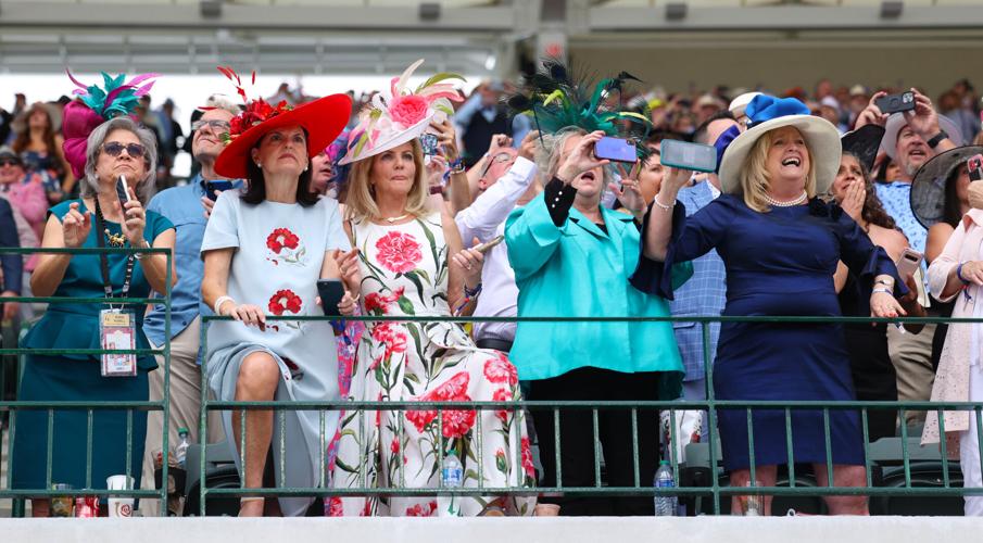 Women look on during Kentucky Derby.JPG