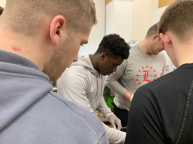 U of L athletes volunteer at Ronald McDonald House (Jan. 20, 2020)