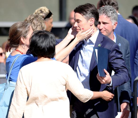 Morgan McGarvey is embraced during vigil.JPG