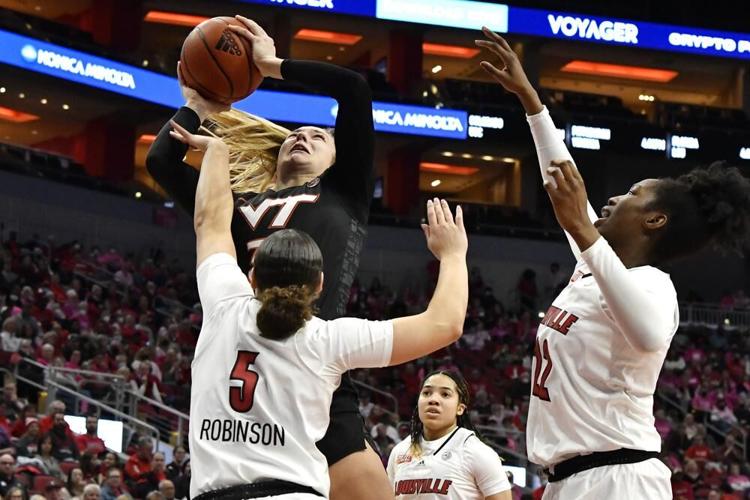 Virginia Tech center Elizabeth Kitley shoots over Louisville guard Mykasa Robinson.jpeg