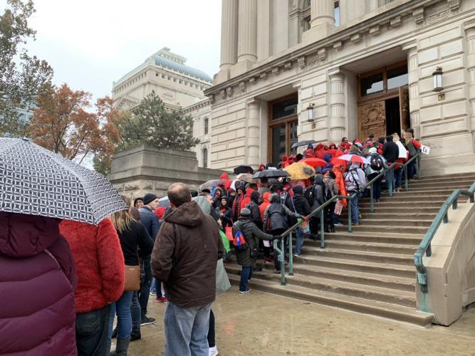 GO RED FOR ED - Teachers in Rain.jpg