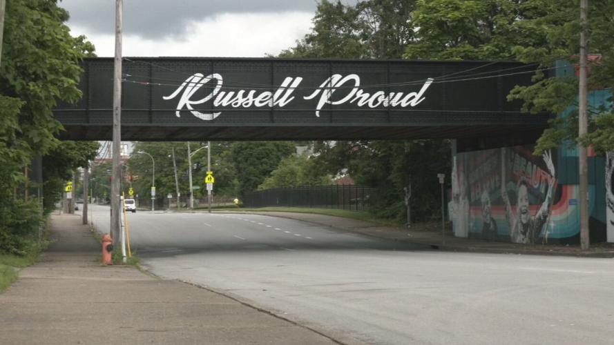 Russell Proud Sign.