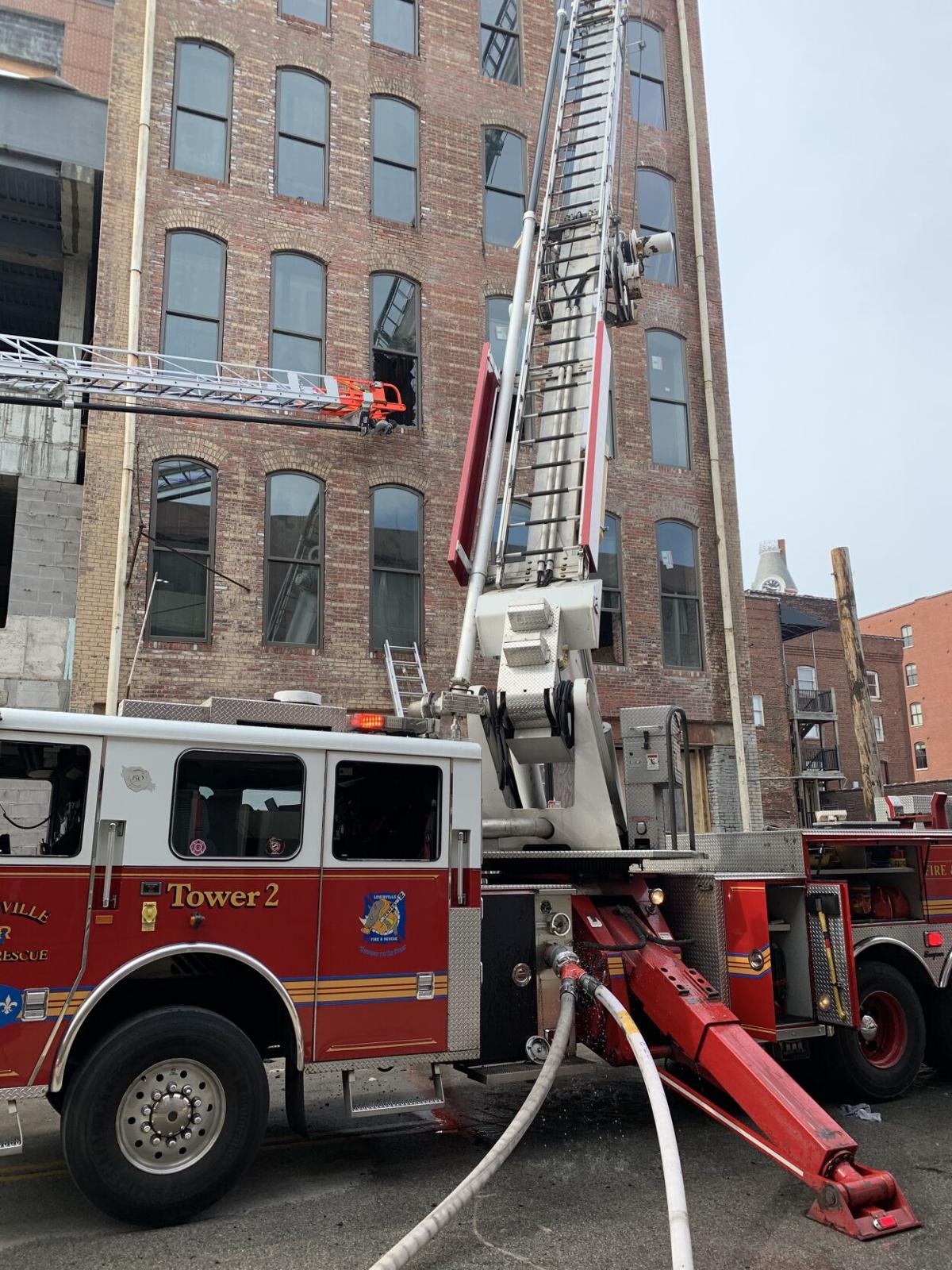 Fire crews battle fire atop downtown Louisville building News