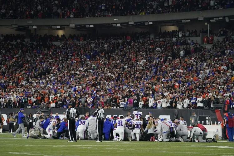The Buffalo Bills players pray for teammate Damar Hamlin - AP FILE.jpg