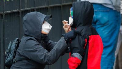 Woman and child, COVID-19 protective masks, New York, generic