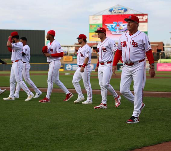 Pat Kelly walks in Louisville Bats dugout.JPG