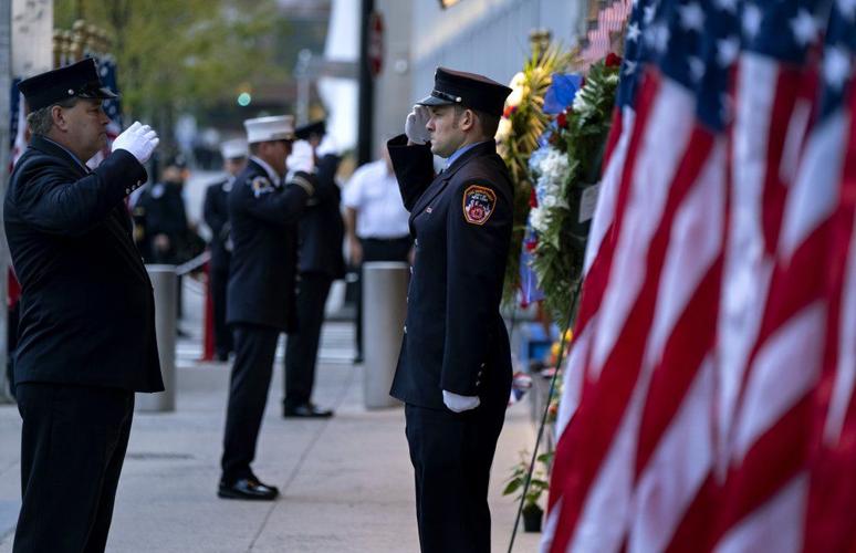 New York City firefighters salute at memorial on 9-11-19