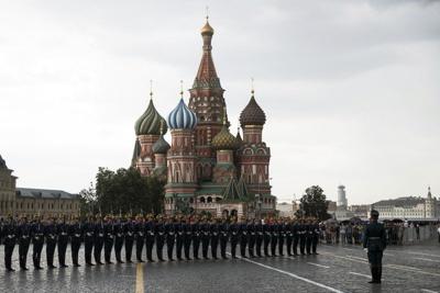 Kremlin guards perform in Red Square with St. Basil's Cathedral in the background