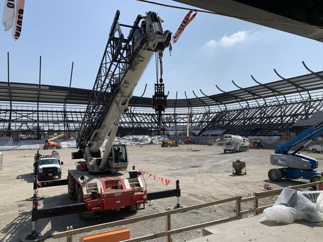 Crews finish laying the steel structure for the stadium roof