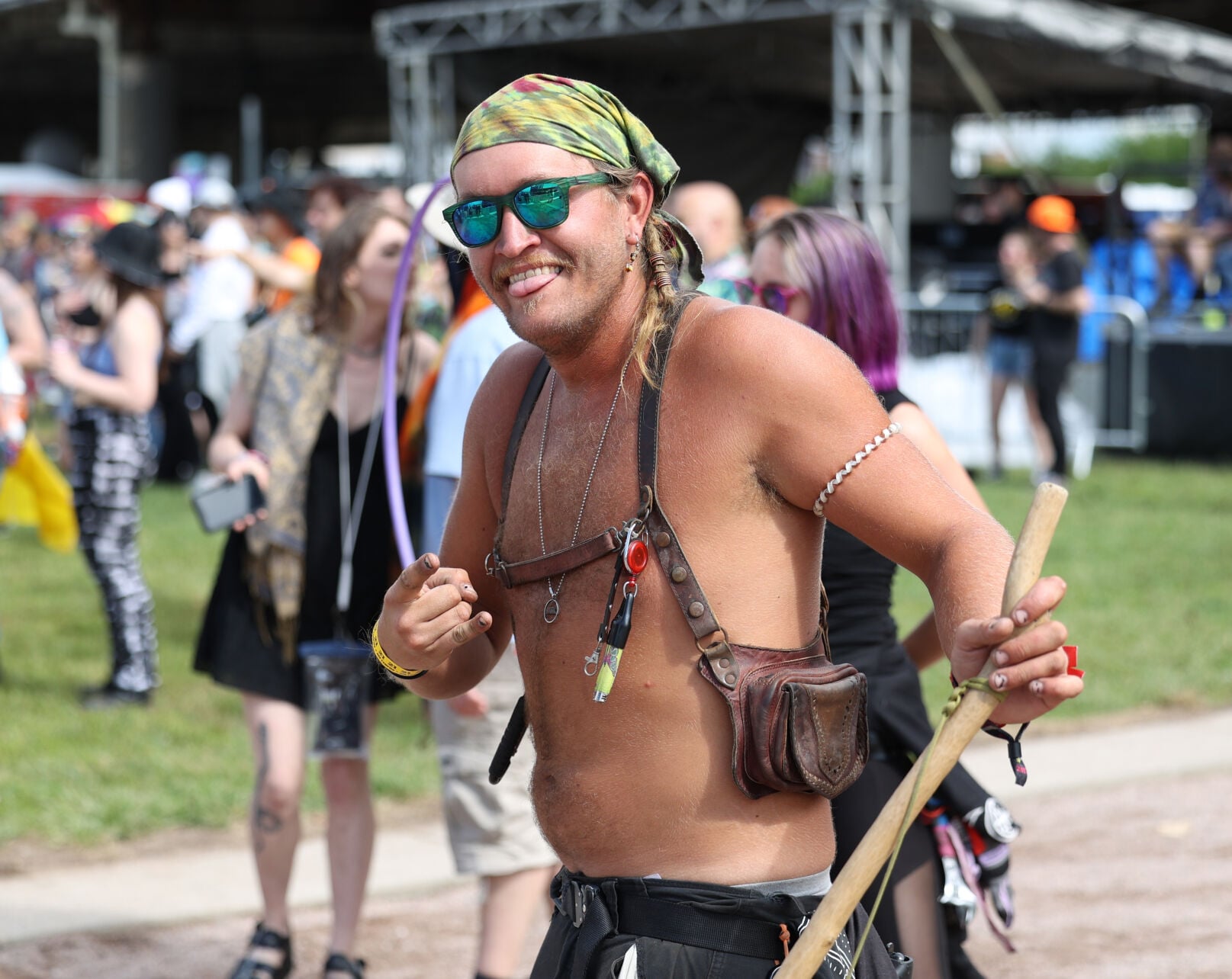 A man twirls a baton at Forecastle 2022.JPG