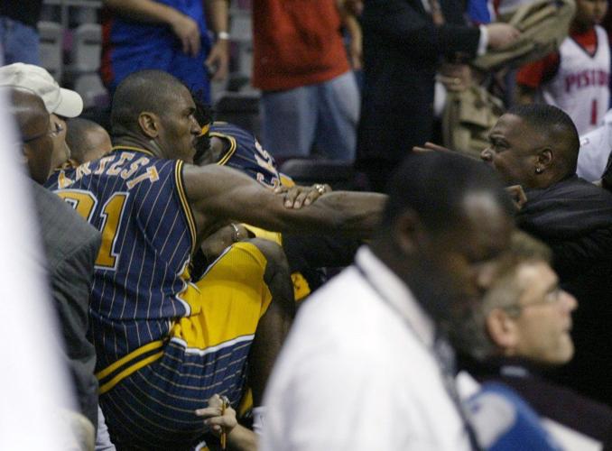 Indiana Pacers forward Ron Artest gets into the stands to fight