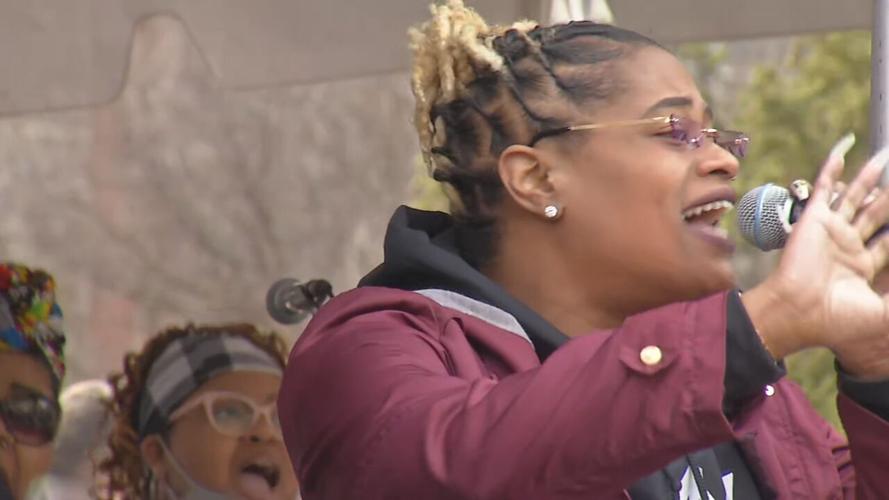 A choir performs at a rally marking one-year anniversary of Breonna Taylor's death