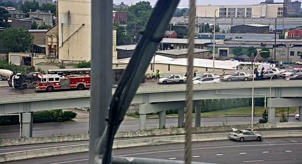 Overturned Semi hauling pigs on I-64S ramp