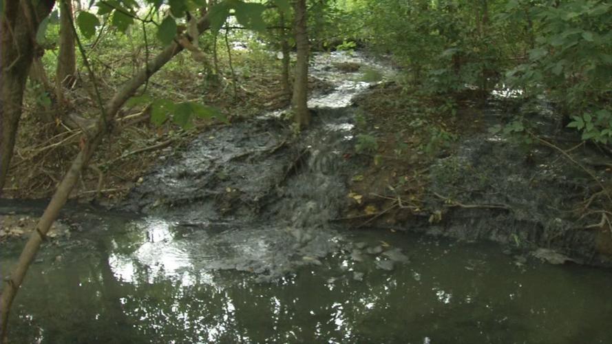 Sewage runoff after collapse of sewage treatment plant in Hunters Hollow, Kentucky